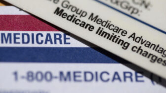 In this file photo, a Medicare Advantage PPO card rests on top of a Medicare card in Portland, Ore., June 10, 2024.
