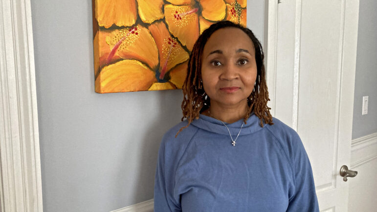 Sharonda Ware stands in her house located in the Huntsville metro on September 23, 2025. She was told in 2018 that she needed to move from the Washington DC area to keep her FBI job.