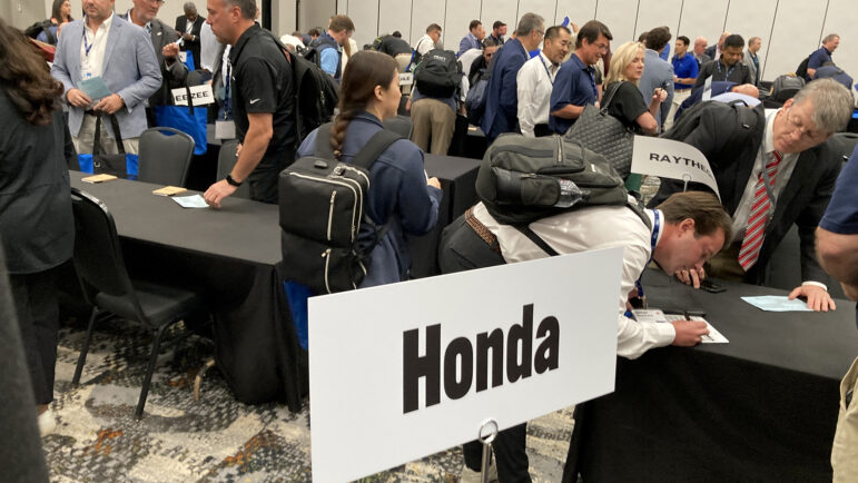 Sellers sign up for five-minute meetings with different car makers and manufacturers in the Southern Automotive Conference, in Huntsville, Alabama, on October 7, 2025.