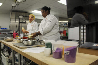 Denae Reddick (center) and Leslie Jarreau, instructors at New Orleans Culinary and Hospitality Institute, divide king cake dough for students on Saturday, Jan. 17, 2026.