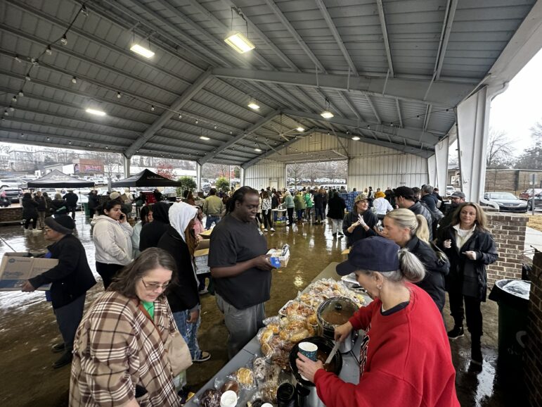 Community members receive hot meals at the Oxford Community Market on Feb. 3. That Tuesday would have been OXCM's first farmers' market of the 2026 season, but it became a place for the community to additionally get a warm meal and other resources.